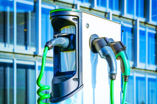 Electric Car Charging station. Battery hybrid vehicle eco charger. Future energy power. Green technology. Transport plug. Fuel recharge. Clean ecology concept. Modern supply